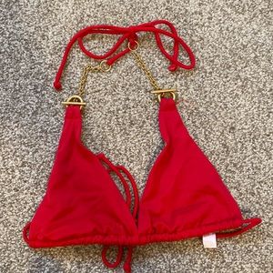 Victoria’s Secret red triangle bikini top with gold chain strings. Size small.